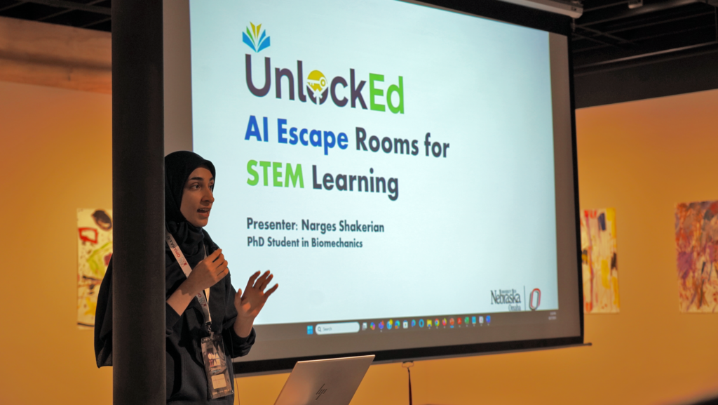 Narges Shakerian, a Ph.D. student in biomechanics at the University of Nebraska at Omaha, presents her project, AI-powered Escape Rooms for Interactive Learning, which earned third place in the OMA x AI student competition.