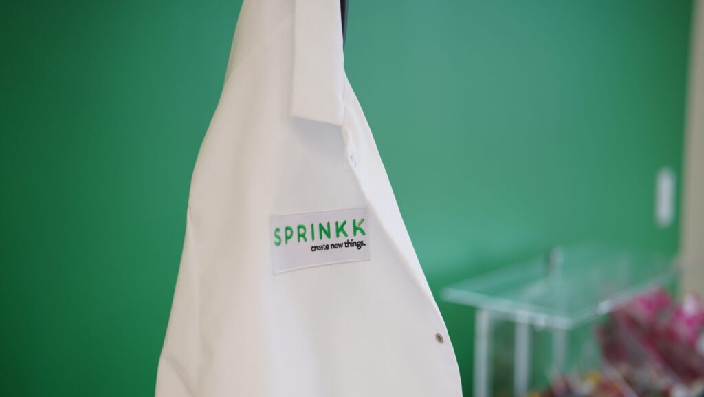 Lab coat hanging in one of the Sprinkk candy development facilities in Nebraska.