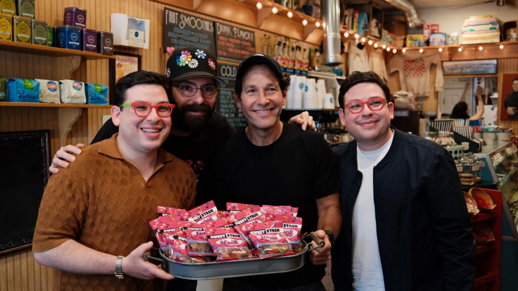 Ezra Potash (left), Martin Starr (first from left) and Adeev Potash (right) pose with actor Paul Rudd and a batch of Sweet Stash “Jams” gummies. Sweet Stash’s first retail showing was at Samuel’s Sweet Shop in New York, co-owned by Rudd. After the launch, the startup focused on growing its presence in Nebraska and the Midwest.
