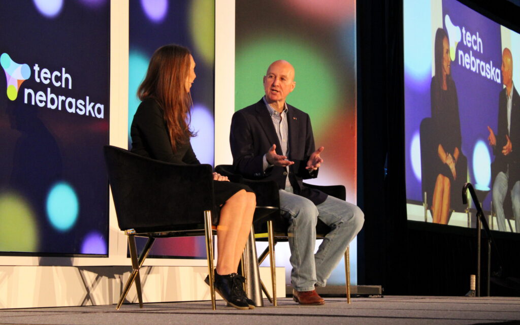 Nebraska U.S. Sen. Pete Ricketts (right) participates in a fireside chat with Tech Nebraska Executive Director Emily Allen at the 2026 Tech Nebraska Summit on Oct. 21, 2026, at the CHI Health Center in Omaha. Photo by Ben Goeser/Silicon Prairie News